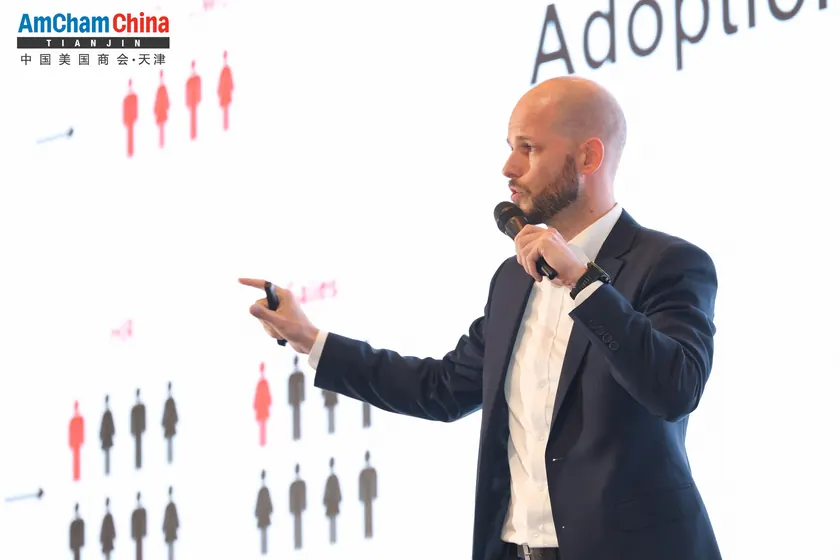 Nil Larom speaking on AI adoption at AmCham China